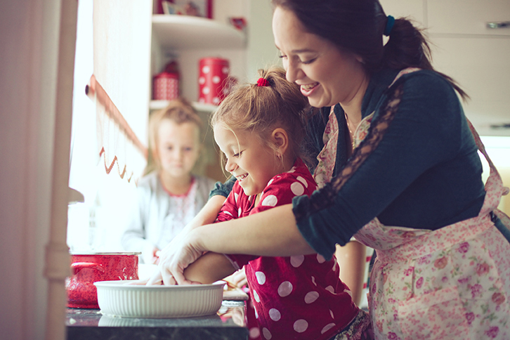 young mother and children in kitchen