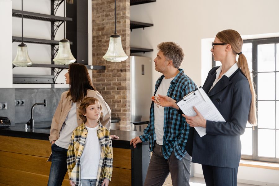 family with bad credit touring a house with a real estate agent in Redding CA