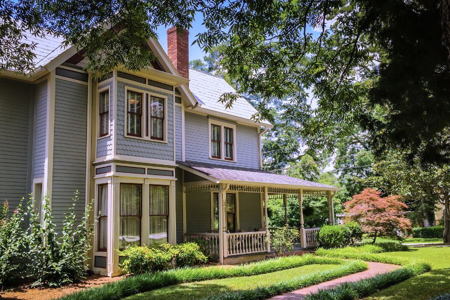 backyard view of a two story home in Redding CA with a lush backyard