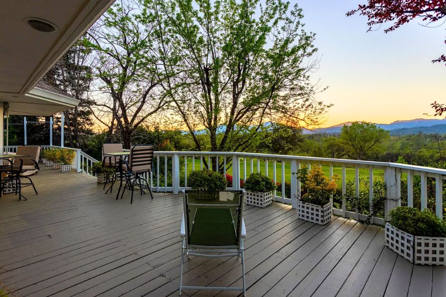 rear deck on a home in Redding CA overlooking a large property with mountains in the background